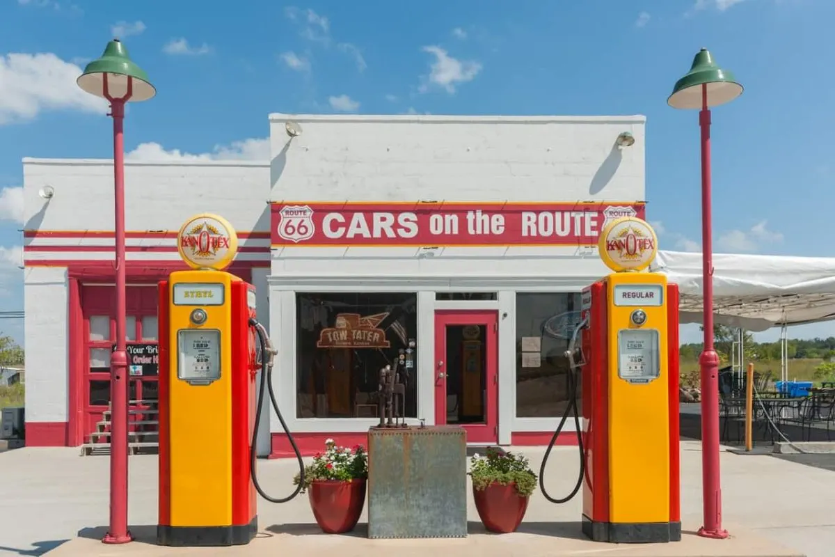 Cars on Route 66 signage on retro service station